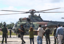 An Indonesian Air Force helicopter prepares to fly to Timika