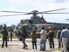 An Indonesian Air Force helicopter prepares to fly to Timika