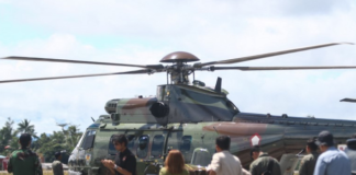 An Indonesian Air Force helicopter prepares to fly to Timika