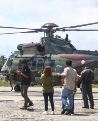 An Indonesian Air Force helicopter prepares to fly to Timika