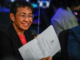 Standing in front of her news organisation’s logo, Rappler chief executive Maria Ressa
