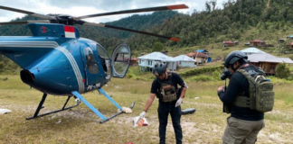 Operation Peace Cartenz investigators at the scene where New Zealand helicopter pilot Glen Malcolm Conning was reportedly shot dead