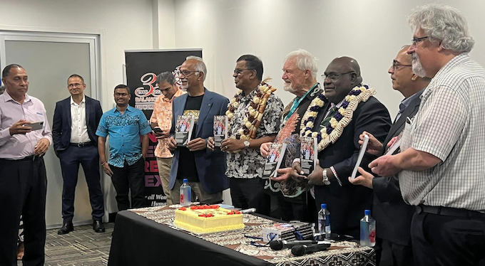 Fiji's Deputy PM Professor Biman Prasad (sixth from left) and PNG's Communications Minister Timothy Masiu (third from right) at the launch of the 30th anniversary edition of PJR