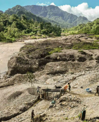 Artisanal miners search for gold in the waters downstream from the Panguna mine