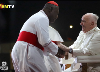 PNG's Catholic Archbishop of Port Moresby Cardinal Sir John Ribat welcomes Pope Francis during his four nation Pacific and Southeast Asian tour