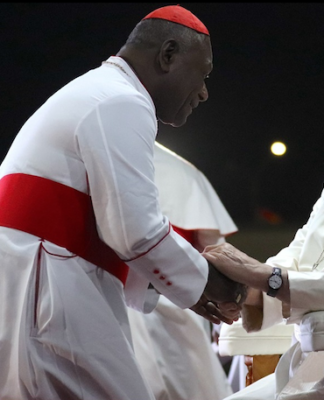 PNG's Catholic Archbishop of Port Moresby Cardinal Sir John Ribat welcomes Pope Francis during his four nation Pacific and Southeast Asian tour
