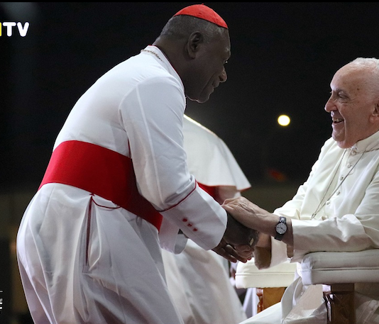 PNG's Catholic Archbishop of Port Moresby Cardinal Sir John Ribat welcomes Pope Francis during his four nation Pacific and Southeast Asian tour