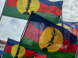 Kanak flags lifted high at a pro-independence rally in Nouméa