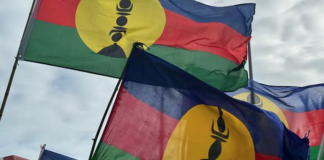 Kanak flags lifted high at a pro-independence rally in Nouméa