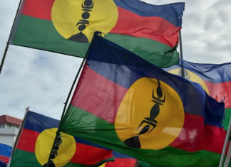 Kanak flags lifted high at a pro-independence rally in Nouméa