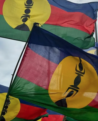 Kanak flags lifted high at a pro-independence rally in Nouméa