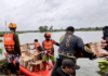 Filipino rescuers at work in Mangcayo barangay near Vinzons, Bicol