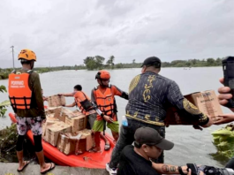 Filipino rescuers at work in Mangcayo barangay near Vinzons, Bicol