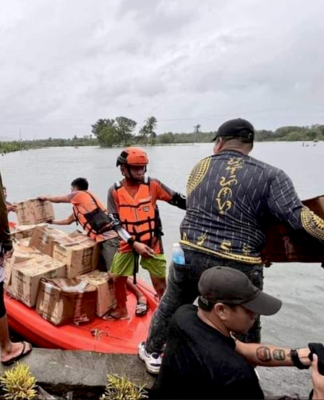 Filipino rescuers at work in Mangcayo barangay near Vinzons, Bicol
