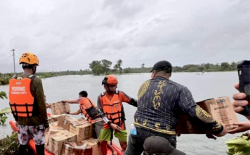 Filipino rescuers at work in Mangcayo barangay near Vinzons, Bicol