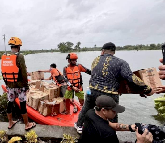 Filipino rescuers at work in Mangcayo barangay near Vinzons, Bicol