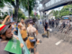 Security forces watch from behind barbed wire as indigenous Papuans from Merauke in the Indonesia-ruled Melanesian region protest