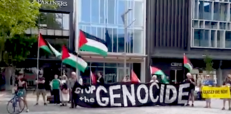 "Drop the genocide" banner at today's protests against Israel's war on Gaza in Christchurch Ōtautahi