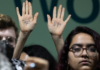 A protester at COP29 calls on wealthy nations to "pay up"