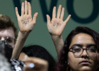 A protester at COP29 calls on wealthy nations to "pay up"