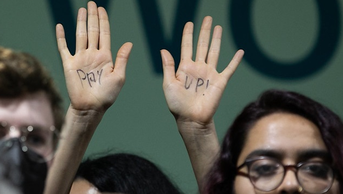 A protester at COP29 calls on wealthy nations to "pay up"