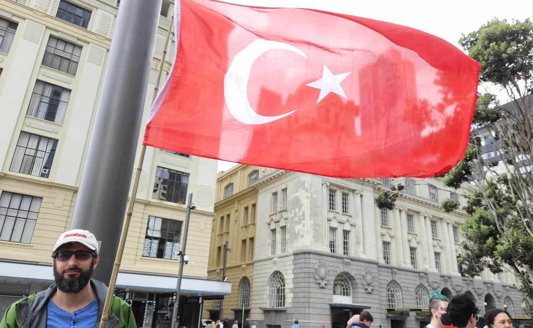 A protester with the Turkish flag at Saturday's Palestine and Lebanon solidarity rally in Auckland