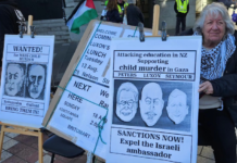 A "Netanyahu wanted for child killing" placard at a Palestine solidarity rally in Auckland this month