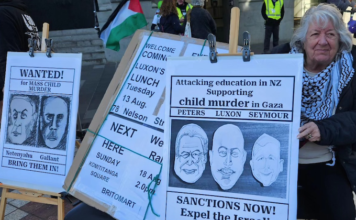 A "Netanyahu wanted for child killing" placard at a Palestine solidarity rally in Auckland this month