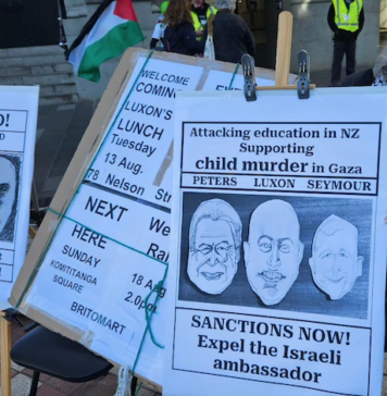 A "Netanyahu wanted for child killing" placard at a Palestine solidarity rally in Auckland this month