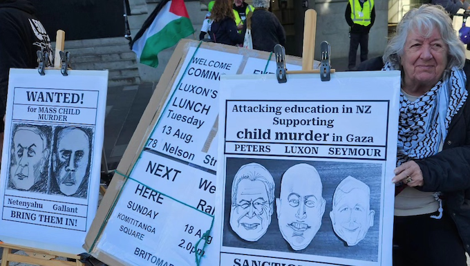 A "Netanyahu wanted for child killing" placard at a Palestine solidarity rally in Auckland this month