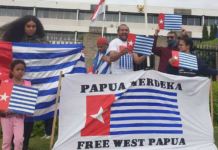 A "raising the Morning Star" flag protest outside the Indonesian Embassy in Canberra in 2021