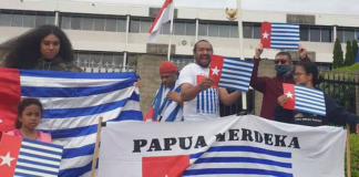 A "raising the Morning Star" flag protest outside the Indonesian Embassy in Canberra in 2021