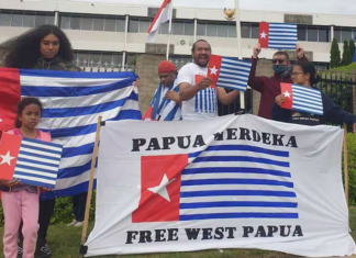 A "raising the Morning Star" flag protest outside the Indonesian Embassy in Canberra in 2021