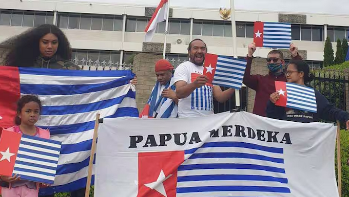 A "raising the Morning Star" flag protest outside the Indonesian Embassy in Canberra in 2021