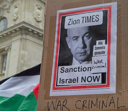 "Zion Times - Sanction Israel now" Bibi commits genocide - war criminal"