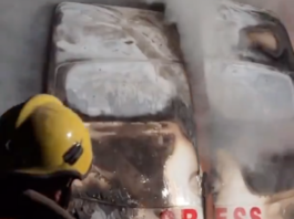 The burnt out vehicle with the clearly visible "Press" label in which an Israeli strike killed the five journalists in Gaza