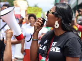 A protester in a "Free Palestine" t-shirt