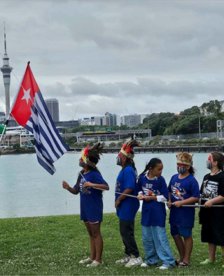 Tamariki raising the West Papuan independence flag Morning Star