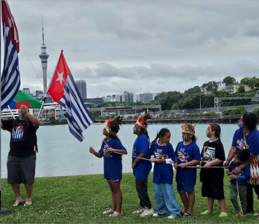 Tamariki raising the West Papuan independence flag Morning Star