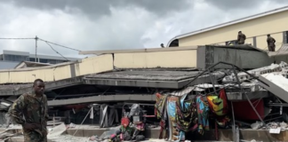 Rescue operations underway on a commercial building flattened by the earthquake in Vanuatu 17 Dec 2024