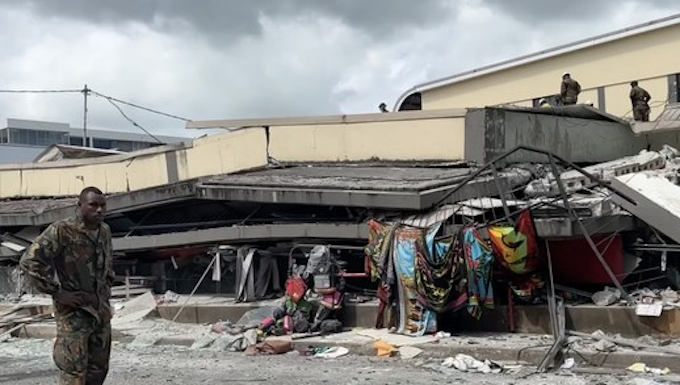 Rescue operations underway on a commercial building flattened by the earthquake in Vanuatu 17 Dec 2024