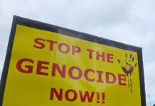 A "Stop the genocide now" placard at Auckland's Te Komititanga Square