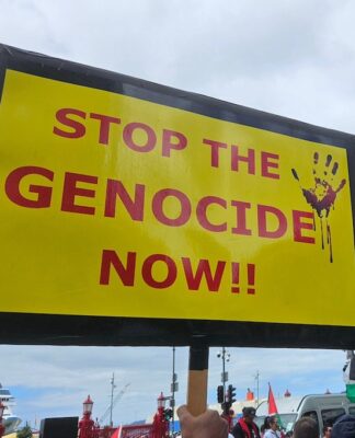 A "Stop the genocide now" placard at Auckland's Te Komititanga Square