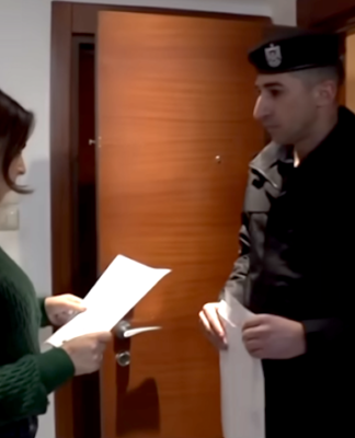 Palestinian Authority security officials deliver the Al Jazeera banning order