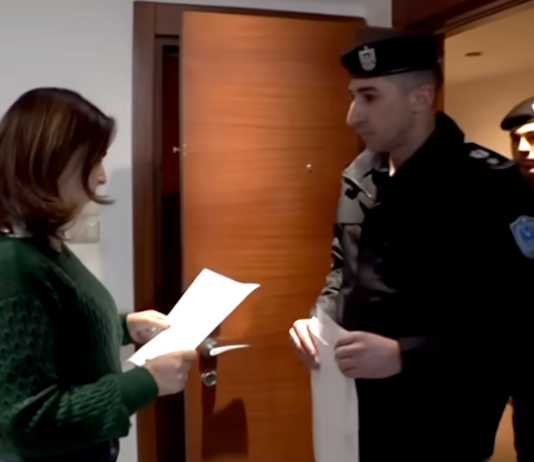 Palestinian Authority security officials deliver the Al Jazeera banning order