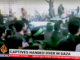 Armed Hamas fighters escort the Israeli captives