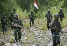 Indonesia defends high number of military deployed in Papua Indonesian military forces on patrol in the Oksop regency