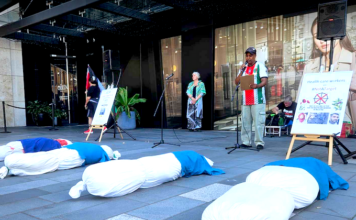 South African activist Achmat Esau speaking out at the New Zealand protest rally in downtown Auckland