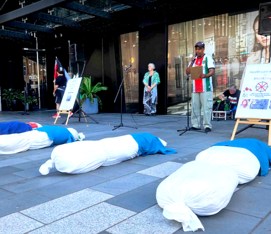 South African activist Achmat Esau speaking out at the New Zealand protest rally in downtown Auckland