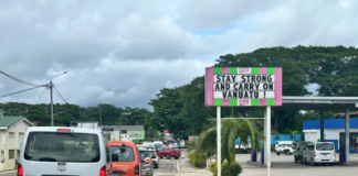 A local business sign in Port Vila reads “Stay strong and carry on Vanuatu”